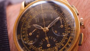 wristshot of the vintage 1930s Universal Geneve Compax chronograph with Base-3000 tachymeter