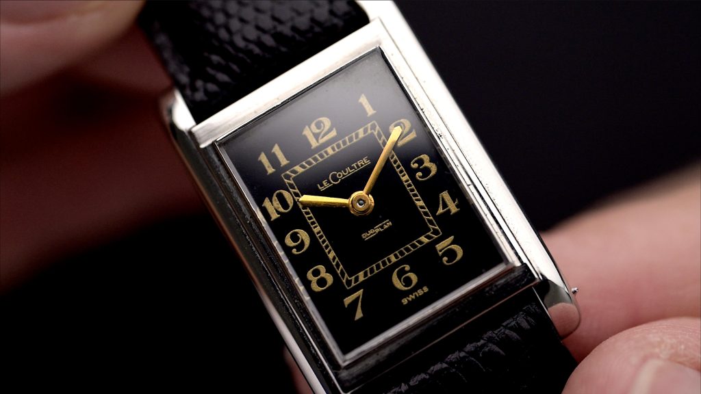Dial close up of a vintage 1940s LeCoultre with black dial, Breguet Numerals and Duoplan movement
