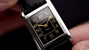 Dial close up of a vintage 1940s LeCoultre with black dial, Breguet Numerals and Duoplan movement
